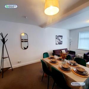 a dining room with a table and chairs at Cheadle Rooftop Apartment by Daley Stays - Sleep 6 in Cheadle Hulme