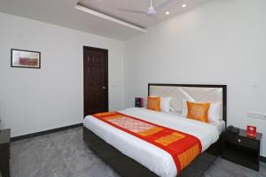 Cama ou camas em um quarto em Jagat Residency
