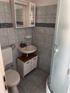 Koupelna v ubytování Apartmani Leila + 37 fotografií