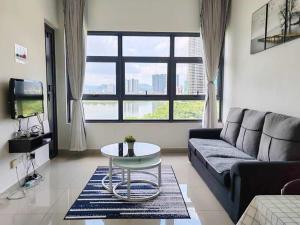 a living room with a couch and a table at The Lake-ville KL Jalan Kuching by M Platinum in Kuala Lumpur