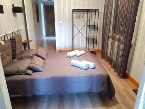 Кровать или кровати в номере Gîte du Lavoir