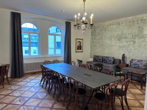 a dining room with a table and chairs at Rilke Apartments in Linz
