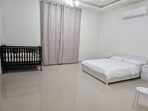 Posteľ alebo postele v izbe v ubytovaní La Villa Muscat