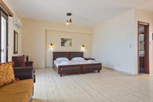 Postel nebo postele na pokoji v ubytování Arkasa Bay Hotel