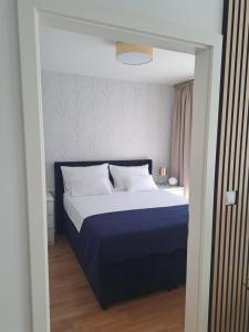Postel nebo postele na pokoji v ubytování Salona Lux
