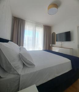 Postel nebo postele na pokoji v ubytování Salona Lux