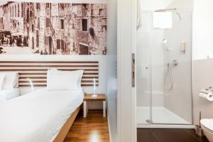 a bedroom with a bed and a shower at Azur Palace Luxury Rooms in Split