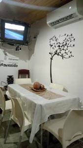 a table with a plate of fruit on top of it at Cabaña La Solanita in Termas de Río Hondo +9 photos