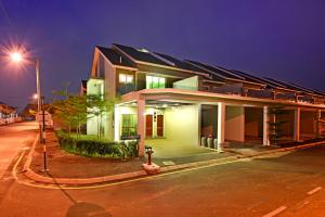 a house with a street light in front of it at Parkview Homes in Ipoh
