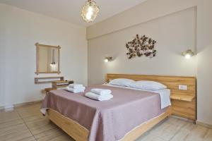 Postel nebo postele na pokoji v ubytování Arkasa Bay Hotel + 29 fotografií