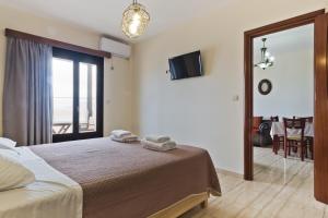 Postel nebo postele na pokoji v ubytování Arkasa Bay Hotel
