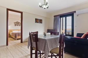 Postel nebo postele na pokoji v ubytování Arkasa Bay Hotel