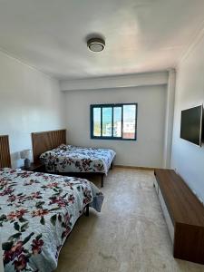 Giường trong phòng chung tại Juan Dolio, Beach Access 2 BR Apt Salitre Tower front of Club Hemingway