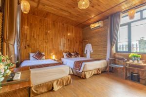 Ein Bett oder Betten in einem Zimmer der Unterkunft Tam Coc Serenity Hotel & Bungalow