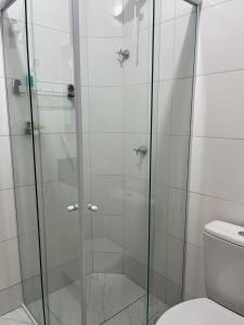a glass shower in a bathroom with a toilet at Apto novo! Recém entregue in Cabedelo