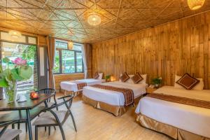 Ein Bett oder Betten in einem Zimmer der Unterkunft Tam Coc Serenity Hotel & Bungalow