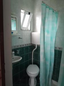 a bathroom with a toilet and a sink at Apartment Potpara in Tivat