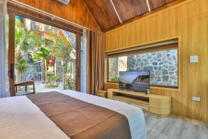 Ein Bett oder Betten in einem Zimmer der Unterkunft Tam Coc Serenity Hotel & Bungalow