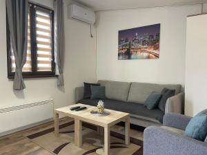 Area soggiorno di Apartman Una