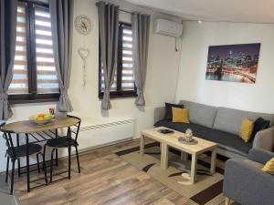 Area soggiorno di Apartman Una