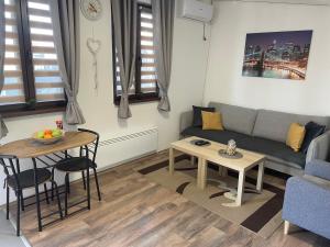 Area soggiorno di Apartman Una
