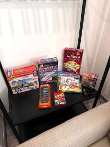 a black table with games and snacks on it at Secret Lakeside in Frauenkirchen