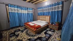 Postel nebo postele na pokoji v ubytování PASANG HOMESTAY