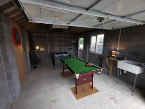 a room with a pool table and a sink at Unbeatable Llanberis Location, Detached with Parking, Snowdon Views. in Llanberis