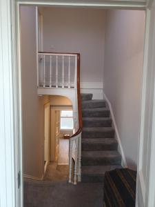 a staircase in a house with a stair case at Eglinton Road - Sleeps 6 on room only basis in Bray