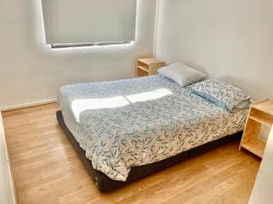 Кровать или кровати в номере Urban Lodge Providencia