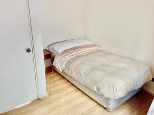 Cama ou camas em um quarto em Urban Lodge Providencia