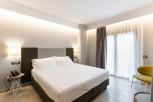 Postelja oz. postelje v sobi nastanitve Hotel Netum Mare