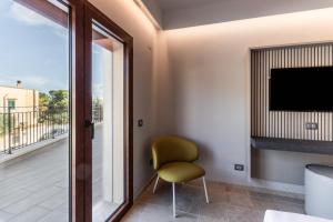 TV in/ali zabaviščno središče v nastanitvi Hotel Netum Mare