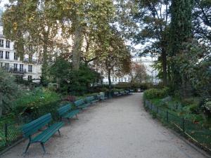 a row of green benches in a park at #SPA Wellness @ Paris 11ème in Paris