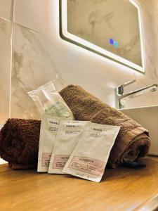 a pile of towels sitting on top of a bathroom counter at Diamonds country-view apt in Marsalforn +11 photos
