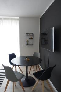 a dining room with a table and chairs at Apartment Annett in Senftenberg