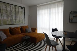 a living room with a couch and a table at Apartment Annett in Senftenberg