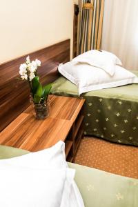 Uma cama ou camas num quarto em Hotel Lyra