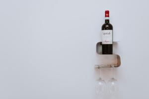 a bottle of wine and two wine glasses at La Luce di Sirmione in Sirmione