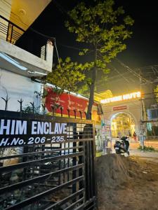 a sign on a fence in front of a building at Chanchal Niwas in Kharar