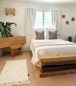A bed or beds in a room at Hacienda Verde Luz La Casona
