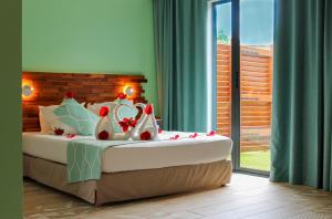 Llit o llits en una habitació de Kawan Bay Suites