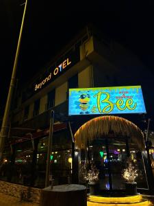 a building with a sign for a restaurant at night at Beyond OTEL in Antalya