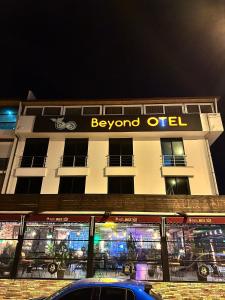 a building with a sign on top of it at Beyond OTEL in Antalya