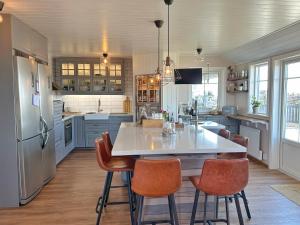 a kitchen with a large table and chairs in it at Lysekil sunset Villa in Lysekil
