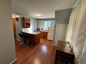 a kitchen with a desk and a counter in a room at Comfy getaway full Apt single bedroom sleeps two! in Niagara Falls