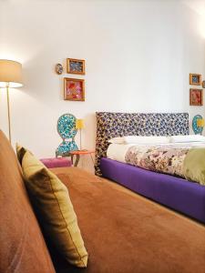 a living room with two beds and a couch at Festina Lente in Rome