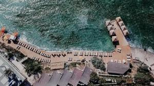 an overhead view of a beach with the ocean at Maja Luxury Resort Hotel in Cesme