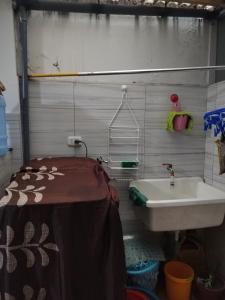 a small bathroom with a sink and a sink at EL MANZANO in Lima