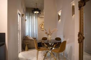 a dining room with a table and chairs at INTOMILAN I Design Apartment in the Heart of Milan in Milan +25 photos